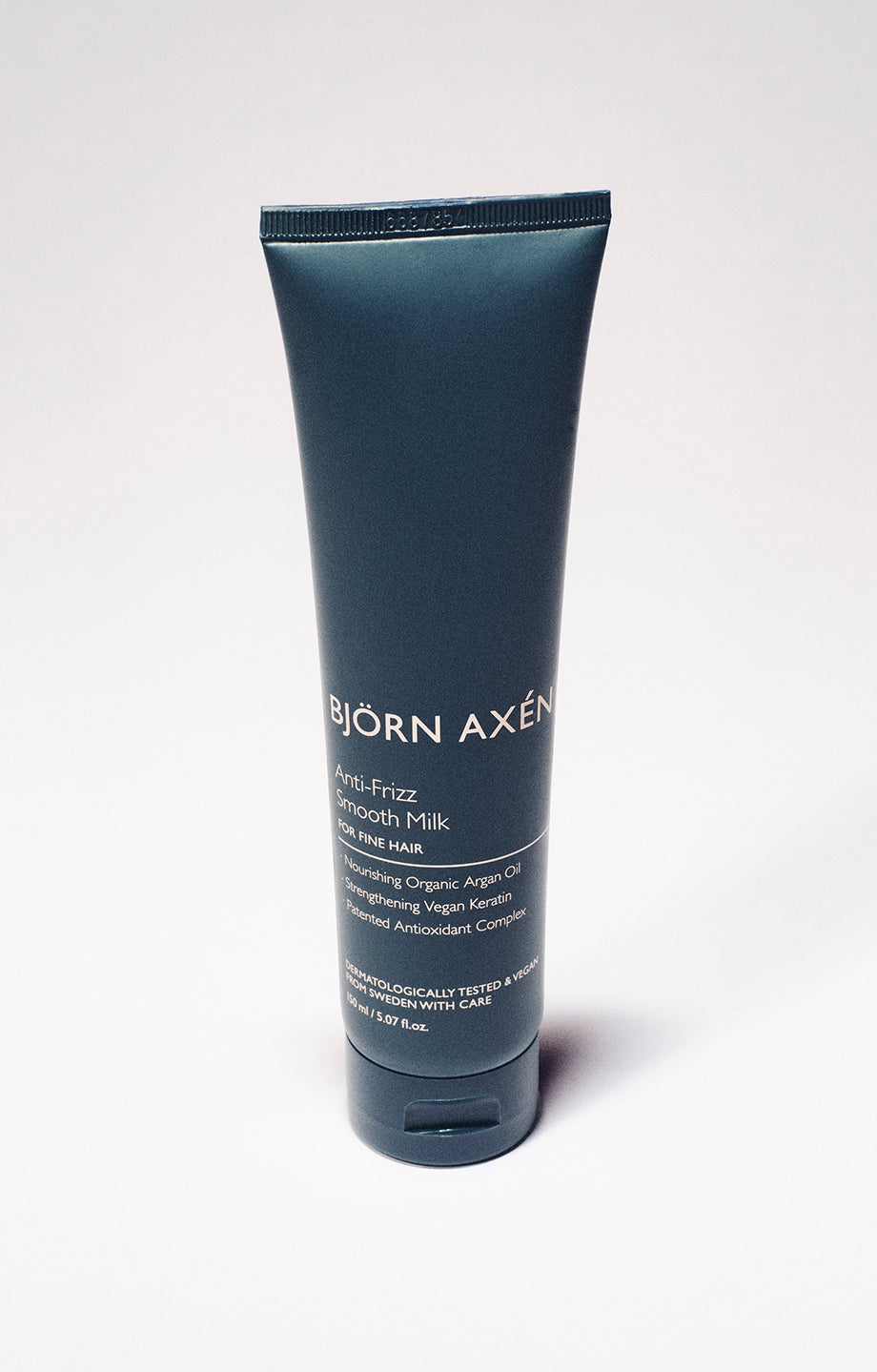 A lightweight leave-in styling milk to soften, smooth and reduce frizz